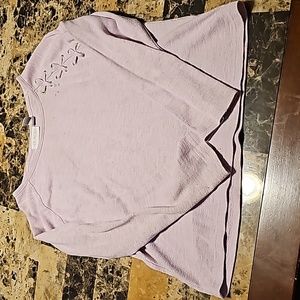 Children place sweater
